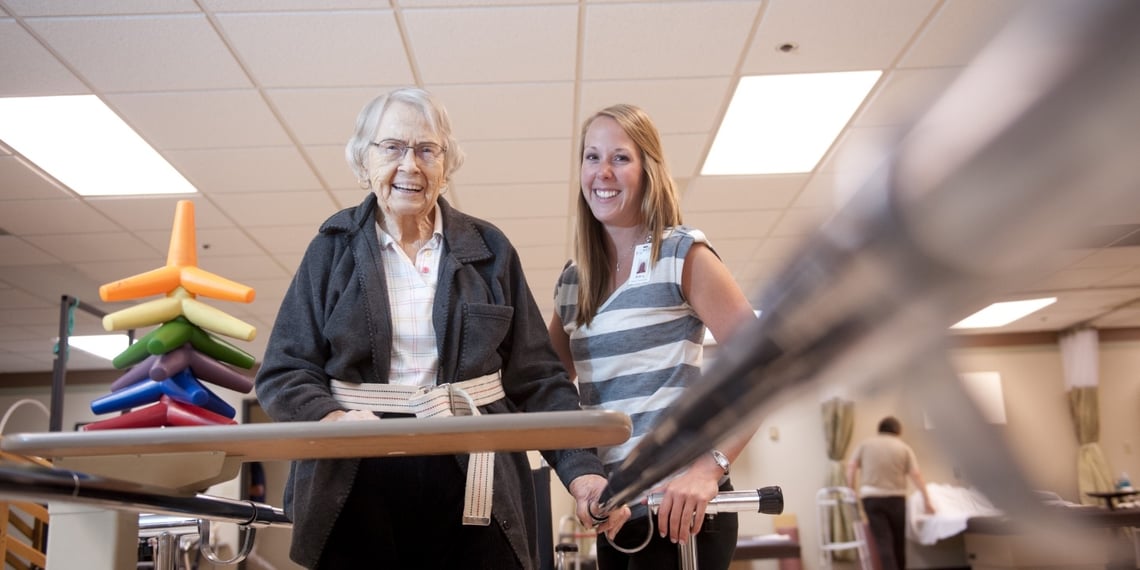 women smiling in physical therapy room